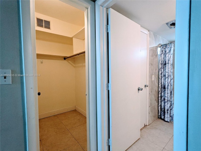 bathroom with tile patterned flooring