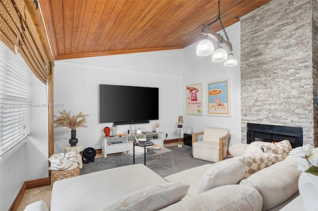 living room with ornamental molding, high vaulted ceiling, a stone fireplace, and wooden ceiling