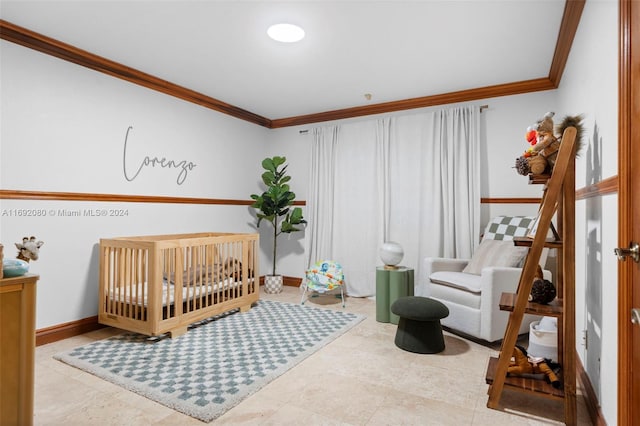 bedroom with a crib and crown molding