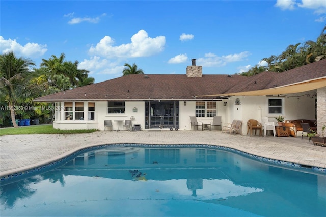 back of property featuring a patio area