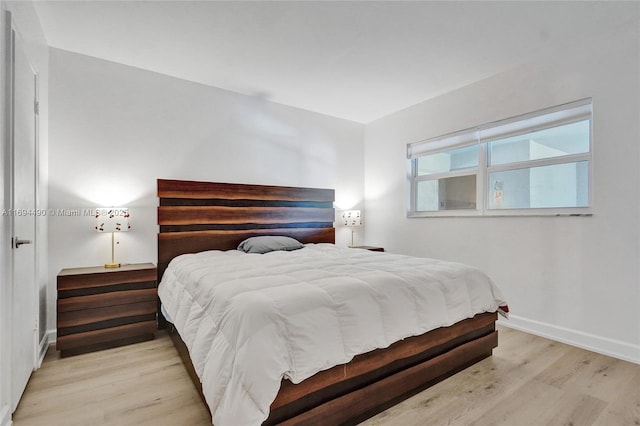 bedroom with light hardwood / wood-style flooring