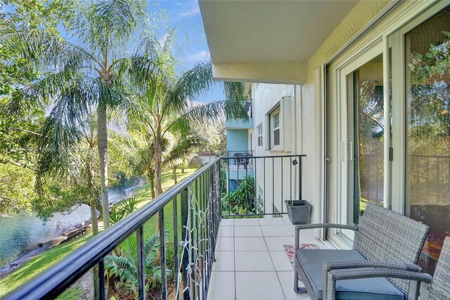 balcony featuring a water view