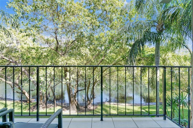 balcony featuring a water view