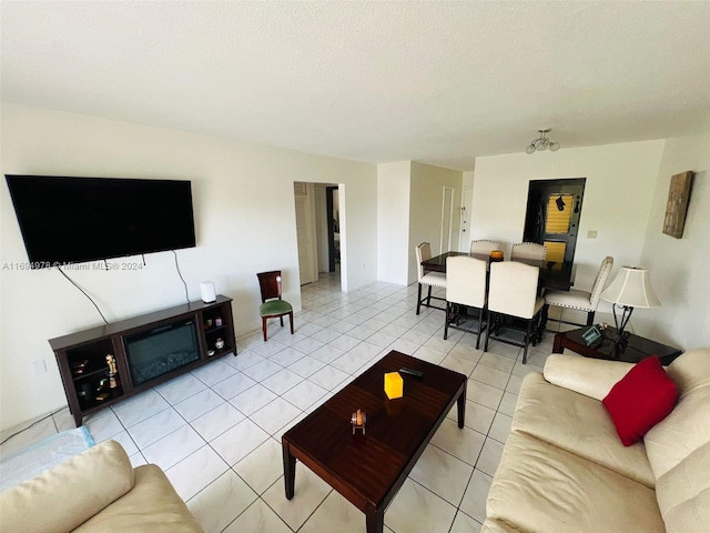 living room featuring tile patterned floors and a textured ceiling