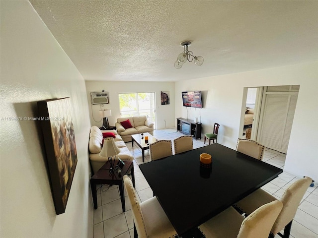 dining room with light tile patterned floors, a textured ceiling, and an inviting chandelier