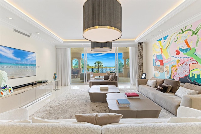 living room featuring tile patterned floors, a raised ceiling, and ornamental molding