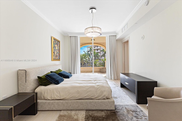 bedroom with access to exterior, crown molding, and light hardwood / wood-style floors