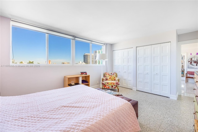 524 Orton Ave Unit 603, Fort Lauderdale, FL 33304 - bedroom featuring baseboards and multiple closets