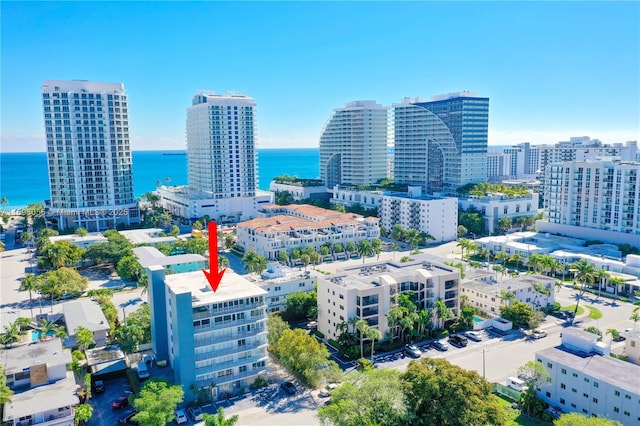 birds eye view of property featuring a water view