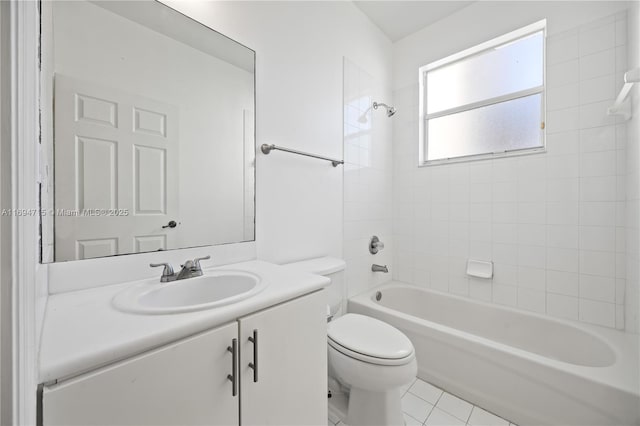 bathroom with toilet, tile patterned flooring, vanity, and shower / bathtub combination