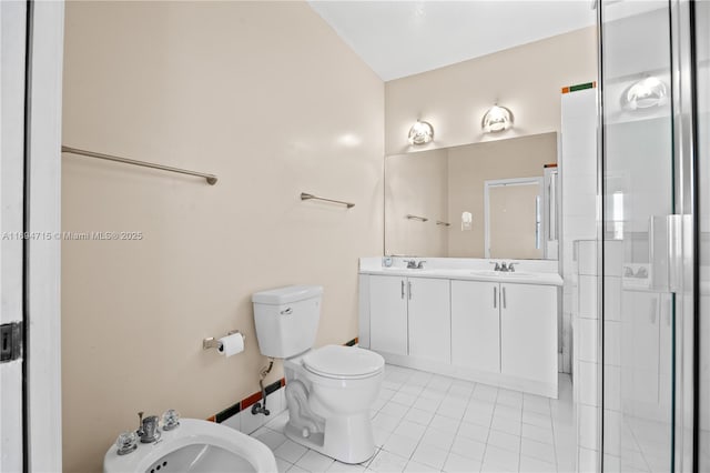 full bath with toilet, a sink, a bidet, tile patterned flooring, and double vanity