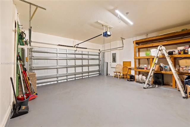 garage featuring electric panel and a garage door opener