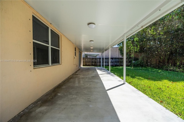 view of patio featuring fence