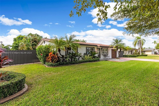 view of front of house with a front lawn