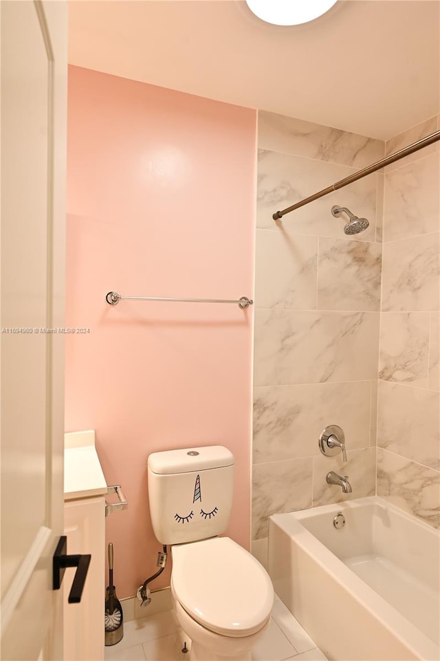 full bathroom featuring tile patterned flooring, vanity, tiled shower / bath combo, and toilet