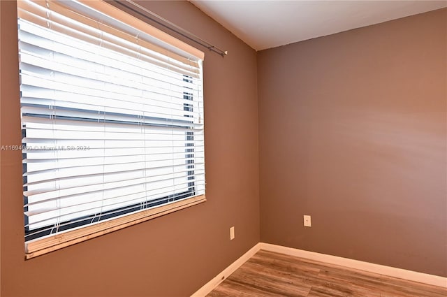 unfurnished room featuring hardwood / wood-style floors