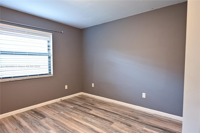 empty room featuring wood-type flooring