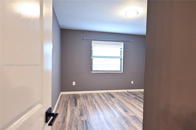 empty room featuring hardwood / wood-style floors