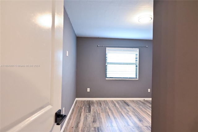 empty room featuring hardwood / wood-style flooring