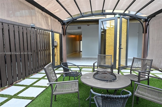 view of patio / terrace featuring a pergola and an outdoor fire pit