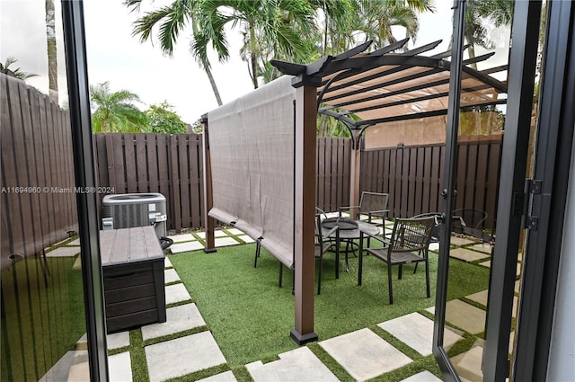 view of patio featuring a pergola and central AC unit