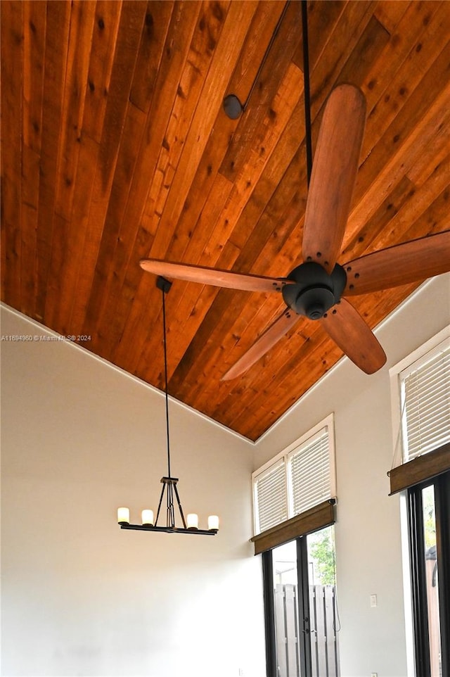 details with ceiling fan with notable chandelier and wooden ceiling