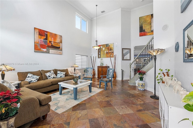 living room featuring crown molding and a high ceiling