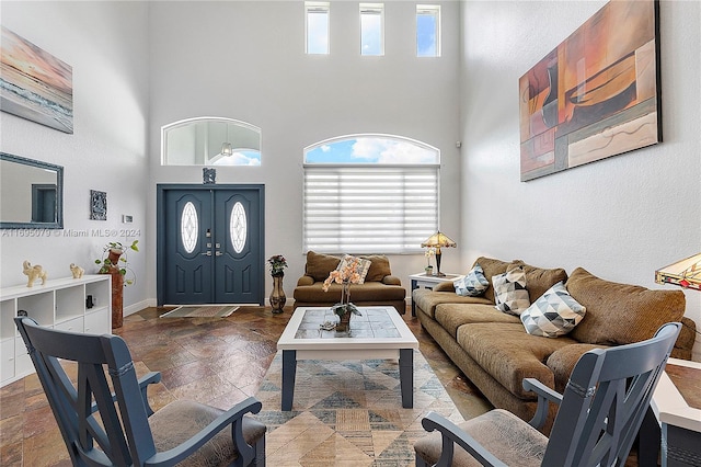 living room featuring a high ceiling