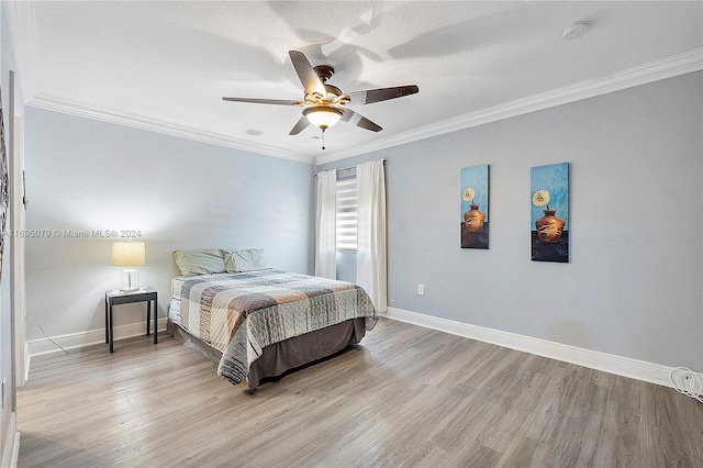 bedroom with ceiling fan, crown molding, and light hardwood / wood-style floors