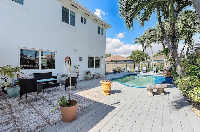 view of swimming pool with outdoor lounge area and a patio area