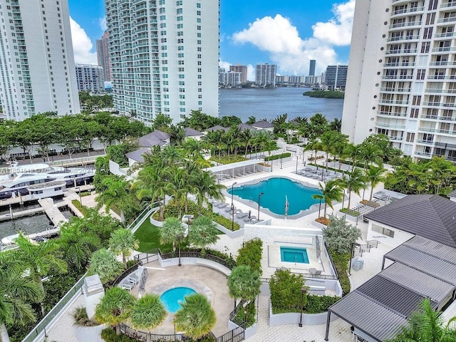 view of swimming pool with a water view