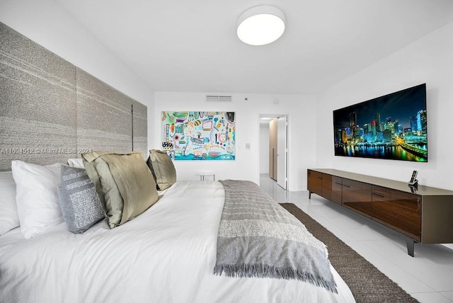 bedroom featuring light tile patterned floors