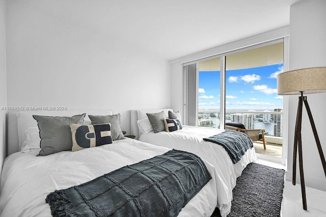 bedroom featuring a water view