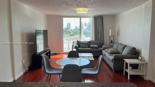 living room featuring dark wood-type flooring