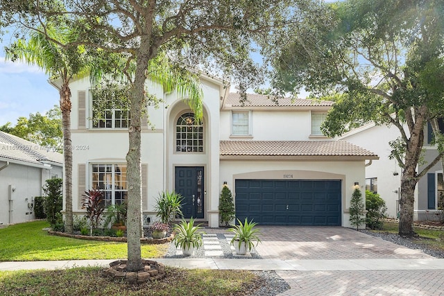 mediterranean / spanish-style house featuring a garage