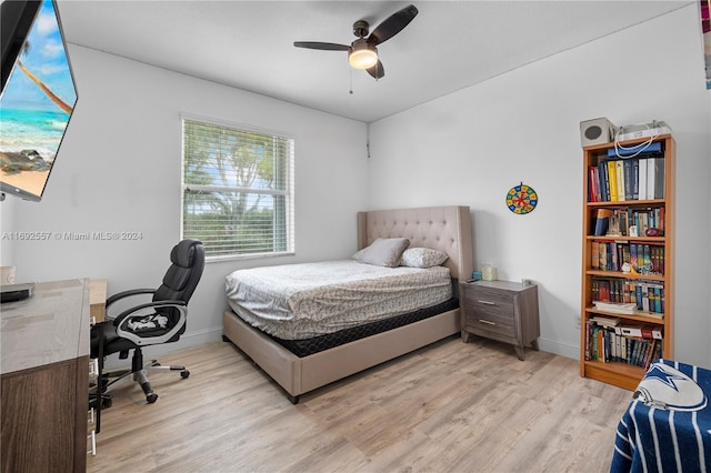 bedroom featuring light wood-type flooring and ceiling fan