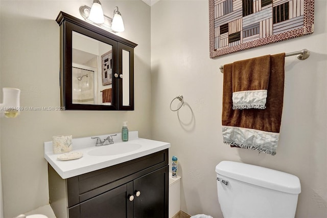 bathroom featuring toilet and vanity