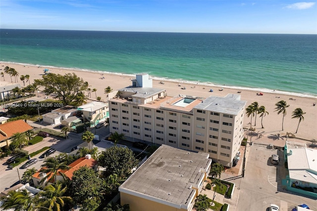 aerial view featuring a water view and a beach view