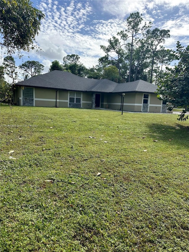 exterior space with a front lawn