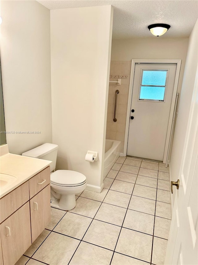 full bathroom featuring tile patterned flooring, vanity, a textured ceiling, and toilet