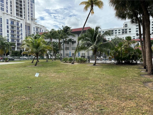 view of home's community featuring a lawn