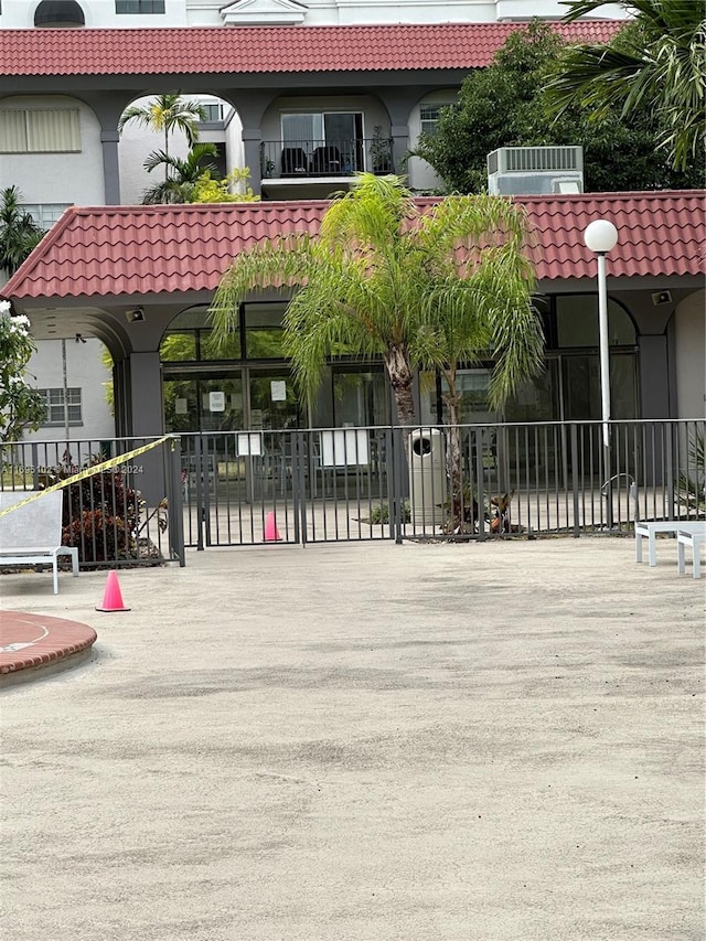 view of gate featuring central air condition unit