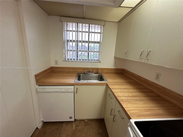 kitchen featuring butcher block counters, white dishwasher, and a sink