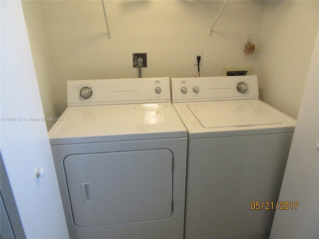 laundry room with washer and clothes dryer