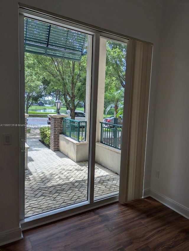 doorway featuring dark hardwood / wood-style floors