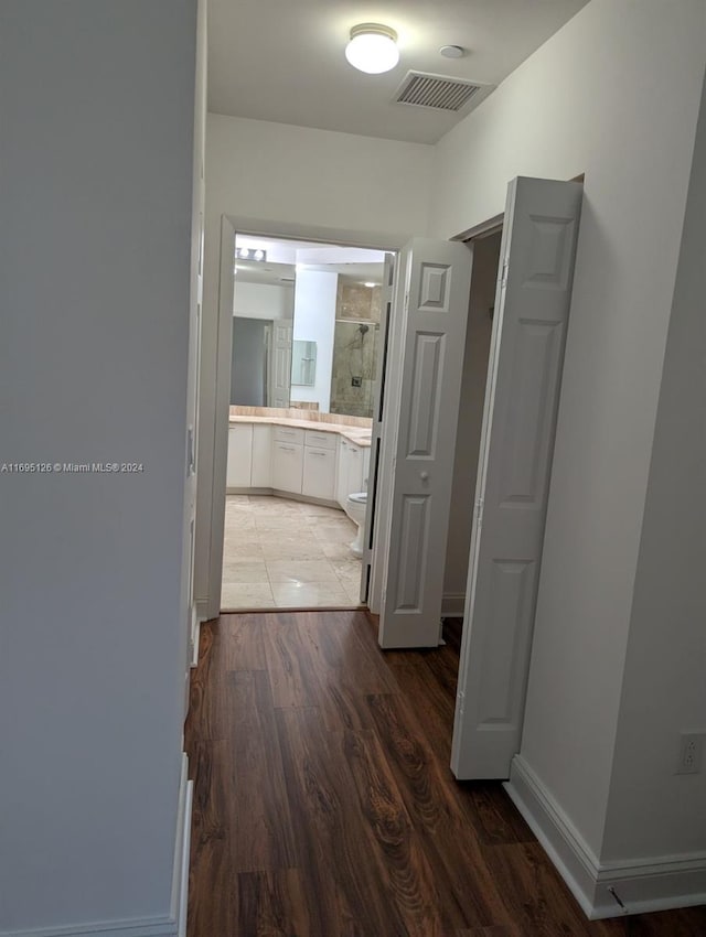 hall with dark hardwood / wood-style floors