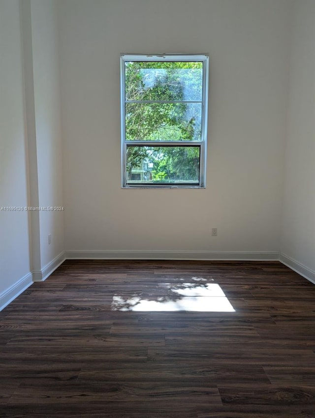 empty room featuring dark hardwood / wood-style floors