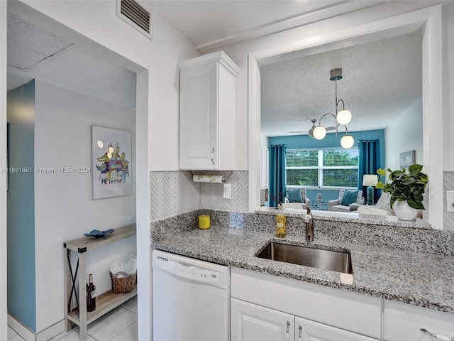 kitchen featuring white cabinetry, dishwasher, sink, and light stone countertops