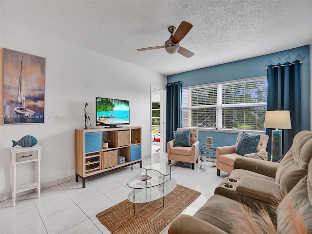 tiled living room with a textured ceiling and ceiling fan