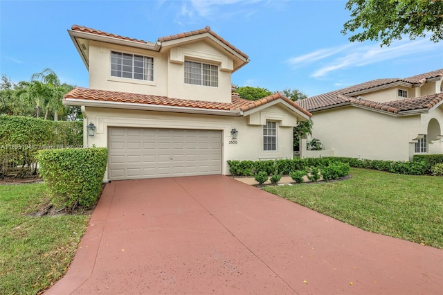 mediterranean / spanish-style home with a front yard and a garage